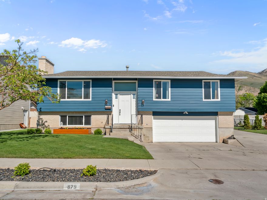 Come purchase this wonderful 4-bedroom, 2.5 bath home in Brigham City.   The living room has new recessed lighting and a cozy fireplace.  Off the kitchen, is a deck that leads to the well-maintained yard with large grass area, swing set, in ground trampoline and raise garden area.  The yard is fully fenced with auto sprinklers.  There is an RV pad to the side of the home for extra parking.  You will find three bedrooms on the main floor.  The primary bedroom has its own 3/4 bath with a tile shower.  Two more bedrooms and a full bath are also on the main level. The basement has a family room, 1 bedroom/office, laundry, storage and 1/2 bath.  The home has many updates with newer carpet and paint throughout.  Electrical meter and panel were recently upgraded.  Located just minutes from 89/I-15 for easy commuting.    Square footage figures are provided as a courtesy estimate only and were obtained from county records.  Buyer is advised to obtain an independent measurement.