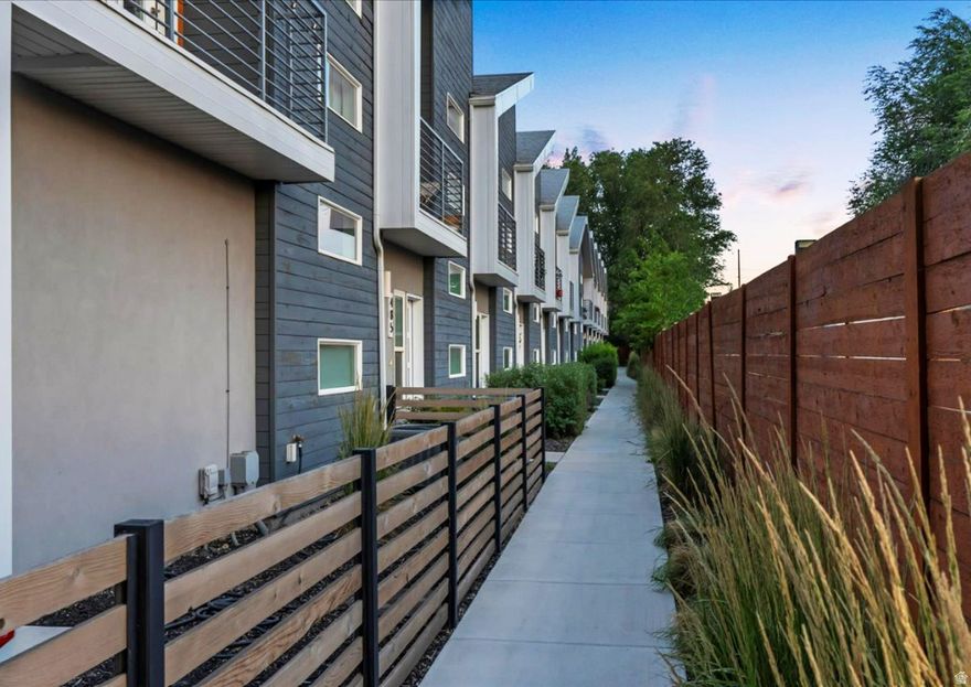 Experience modern city living at its finest in this stunning Salt Lake City townhome located at 449 N Beaumont Ct. Perfectly situated just minutes from the heart of downtown, premier shopping, and world-class entertainment, this impeccably maintained residence offers the ultimate urban lifestyle. The interior is flooded with natural light through expansive windows, highlighting the clean lines and contemporary design throughout. Standout features include a private balcony off the primary suite for relaxing evenings and a pristine, finished garage complete with durable epoxy flooring. Meticulously cared for and move-in ready, this home places you right next to everything the city has to offer while providing a peaceful, light-filled Salt Lake property to call your own.