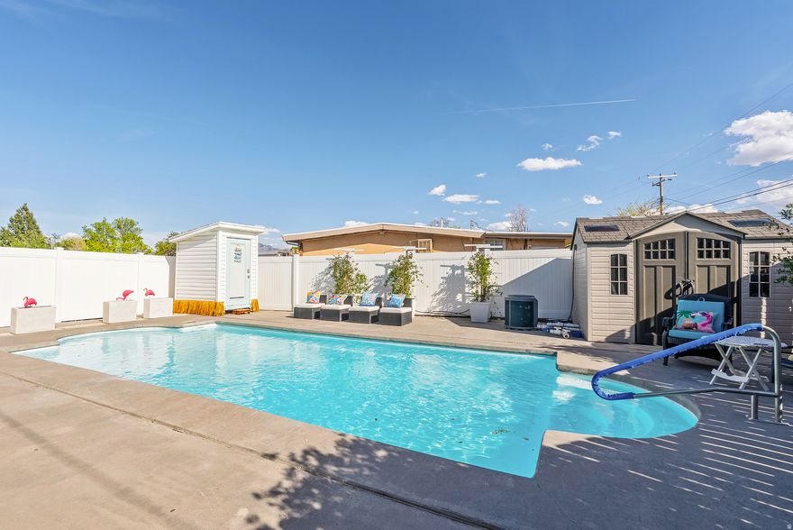 This home is packed with upgrades-owned solar, a saltwater pool, premium lighting, updated electrical, and an oversized garage that's in a league of its own. With 3 bedrooms, and 3 full baths, it's a rambler built for people who expect more.  The garage is the showstopper: true RV storage plus space for multiple vehicles, toys, and projects. You simply won't find garage capacity like this in today's market.  Inside, the upgraded master suite feels like it belongs in a much larger home, and the open floor plan keeps everything comfortable and accessible. Step outside to your private saltwater pool-your own backyard retreat. And thanks to the 16 kW owned solar system, your utility bills stay low while the home runs efficiently.