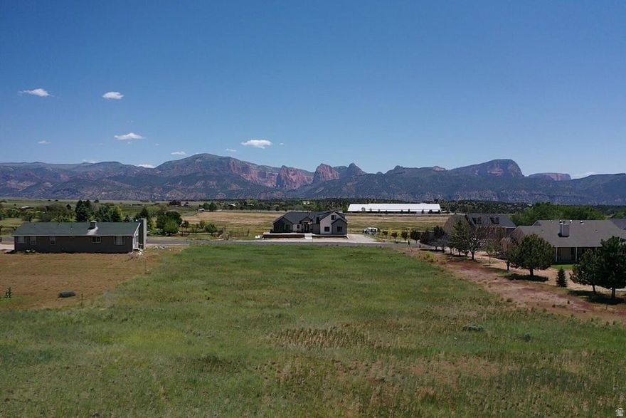 Build your dream home on this beautiful flat 0.92-acre lot with year-round access, and the utilities just need to be connected. Enjoy wide open space, peaceful surroundings, and stunning views of the Kolob Finger Canyons while still benefiting from a low HOA of just $60 a year. Located just 11 minutes to Kolob, this is a rare opportunity to own a spacious lot that's ready for your custom home, vacation getaway, or investment property.