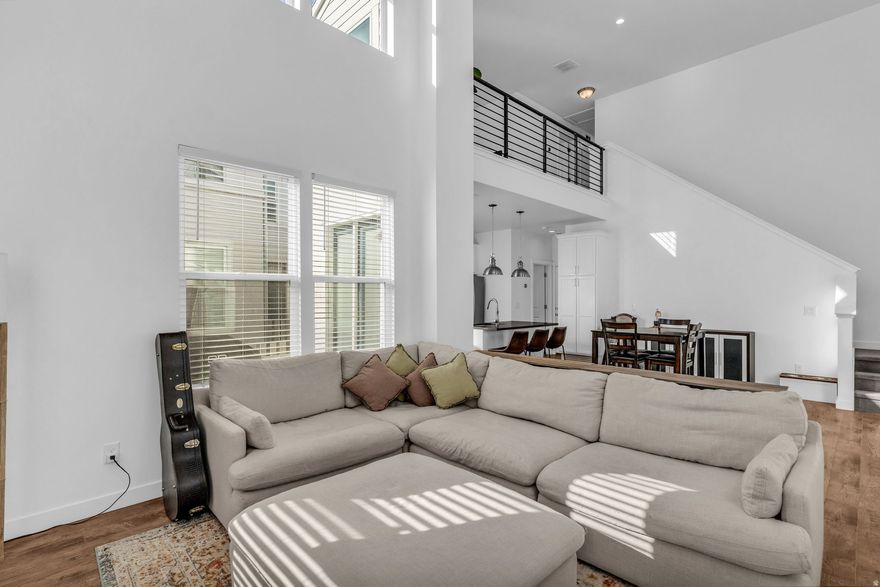 **No showings until the Open House on 1/24/26 12PM-2PM** Welcome to this beautifully appointed townhome located in the highly sought-after Daybreak community of South Jordan. Designed with both style and functionality in mind, this residence offers 2 spacious bedrooms including the Owner's Suite, a versatile loft and 2.5 bathrooms, complemented by high ceilings that enhance the home's open and airy feel. The main level features a bright and inviting living room surrounded by expansive windows, allowing for abundant natural light throughout the space. Windows are equipped with solar powered, remote control blinds. The kitchen is highlighted by quartz countertops, modern finishes, and seamless access to the patio, perfect for indoor-outdoor entertaining. This home offers access to lifestyle and entertainment amenities, including the Salt Lake Bees Stadium, a newly built Megaplex Theatre, scenic walking trails, shopping centers, and quick connectivity to Bangerter Highway and Mountain View Corridor. This is an exceptional opportunity to own a refined townhome in a premier community known for its vibrant atmosphere, convenience, and growth.