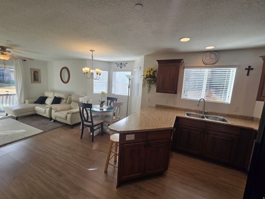 Beautiful Main Level Living. Step into comfort with this bright and beautiful 3-bed, 2-bath main-level condo-conveniently located just minutes from the TRAX station and only a quick 20-minute drive to downtown. You'll love the fresh, modern look with newer LVP flooring and plush carpet throughout, plus the convenience of an included washer, dryer, and refrigerator. Outdoor enthusiasts will appreciate being so close to Big and Little Cottonwood Canyons for incredible hiking, skiing, and adventure all year long. The community amenities are a huge bonus-think sparkling pool, relaxing hot tub, and a well-equipped gym, Playgrounds and Basketball Court. This is the easy-living location you've been waiting for! Square footage taken from the SL county Records Buyers to verify all.