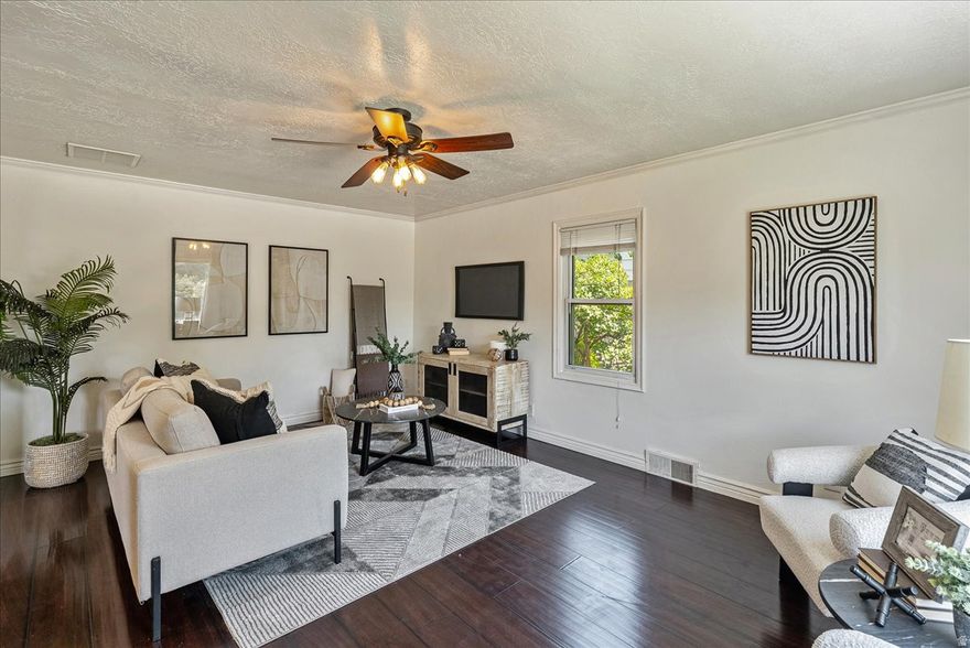 Welcome to this charming 5-bedroom, 2-bath bungalow in the heart of Murray, where timeless character meets modern convenience. Situated on a spacious lot, where even an ADU is a possibility, this 2,050 sq ft home features an open layout with rich wood-style flooring, crown molding, and recessed lighting throughout. The updated kitchen offers stainless steel appliances, stone countertops, and ample cabinetry, while the mostly finished basement provides additional living space, including a second family room, three bedrooms, laundry, and a three-quarter bath-perfect for guests, work-from-home, or multigenerational living. Step outside to a private backyard retreat with a covered patio, mature trees, and full fencing, plus a detached two-car garage with a spacious workshop and upstairs storage. Recent updates include a new roof, HVAC, furnace, electrical panel, and remodeled bathrooms, all within the last five years. Located in the sought-after Murray School District and close to shopping, dining, and recreation, this well-maintained home is move-in ready and full of possibilities! Square footage figures are courtesy estimates from County Records. Buyers should obtain independent measurements.