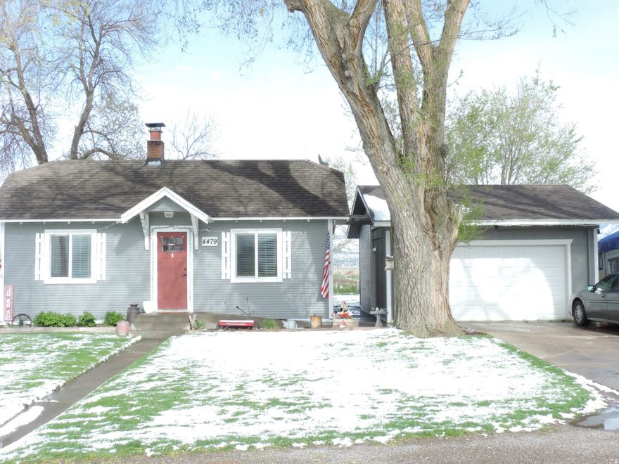 Cute starter home-- Updated in 2017.  Detached  2 car garage.  Garden spot. Chicken coop and chickens included.
