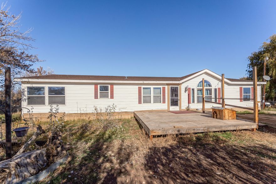 Escape to the peace and quiet of country living with this 3-bedroom, 2-bath home surrounded by open fields and beautiful views in every direction. Sitting on an extra-large lot with mature fruit trees, this property offers plenty of space to garden, expand, or simply enjoy the serenity of rural life.  Inside, you'll find a home full of character that's ready for your personal touch. With a little vision and some TLC, this could easily become your dream country retreat. Whether you're looking to renovate, invest, or create your forever home, this property is bursting with potential - just waiting for the right owner to bring it to life.