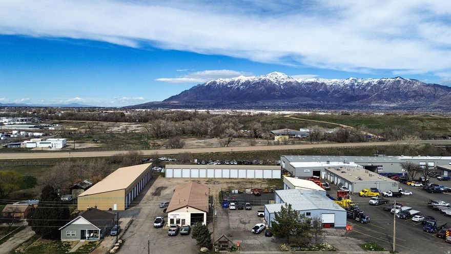 Prime commercial investment opportunity offering strong, established income potential. Situated on 1.59 acres in a mixed-use and industrial area, this versatile property features 27 extra-large storage units, providing consistent revenue. Includes a main warehouse with two separate shop spaces, each equipped with its own restroom and front office area, making it ideal for multiple tenants.  Adding to its versatility, the property includes an on-site residential home, offering  additional rental income.  With multiple income streams, flexible commercial space, and a proven rental history, this property presents an exceptional opportunity for investors.