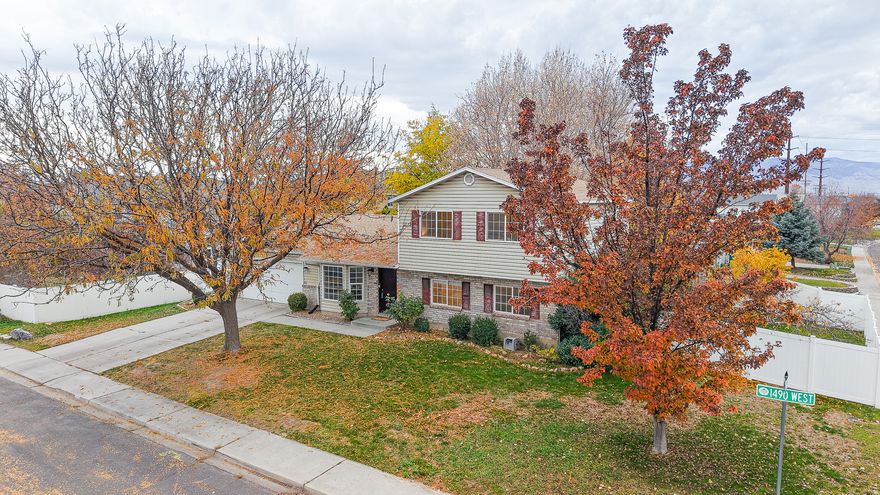 *Be sure to click the tour button for the 3D Tour* Welcome to this charming, bright and cozy home nestled in the desirable and convenient west Orem area. With a newer furnace and new roof, this home is move-in ready and offers peace of mind for years to come. You'll love the large back yard with a garden spot, fruit trees, a strawberry patch and lots of room to play! This space offers endless possibilities! Inside, the thoughtful layout offers 4 bedrooms and 3 full bathrooms providing comfortable living with plenty of space for everyone. Tucked in a quiet neighborhood, this home is centrally located near schools, Lakeside Sports Park, shopping and UVU. Don't miss this chance to own a beautifully cared for home in an incredible location for a fabulous price!