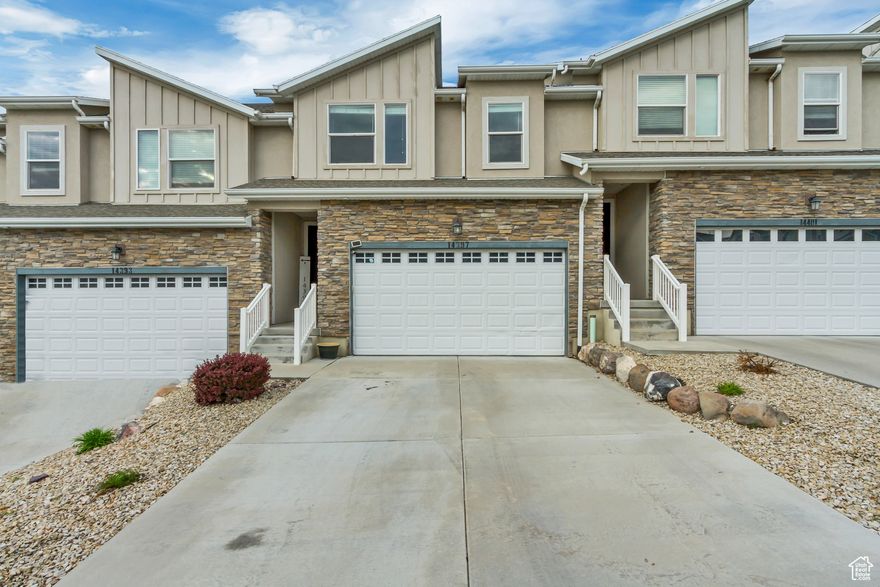 **PRICE ADJUSTMENT** Modern Townhome in the Heart of Herriman  Prime Location, Impeccable Style! Step into this single-owner treasure where modern design meets unbeatable convenience. Perfectly positioned in the heart of Herriman, this stunning townhome offers effortless access to everything you love-shopping, dining, outdoor adventure, and top-rated schools. Inside, the open-concept living space radiates contemporary charm, with abundant natural light pouring through expansive windows. The designer kitchen takes center stage, featuring crisp white cabinetry, a center island with bar seating, gleaming granite countertops, a spacious pantry, and sleek modern lighting. From the dining area, step through sliding doors to your private patio-ideal for sipping morning coffee or enjoying evening sunsets. Upstairs, your primary suite becomes a private retreat, complete with a spacious ensuite, large vanity, and a generous walk-in closet with built-in shelving. Wake up each morning to breathtaking mountain views right from your window. The unfinished basement-with its own separate entrance-offers endless potential to create the space you've always dreamed of, whether it's a home theater, gym, guest suite, or additional living area. Beyond your door, Herriman's vibrant lifestyle awaits. You'll be just minutes from hiking trails, parks, and outdoor recreation, as well as prestigious institutions like the University of Utah Herriman Campus and SLCC Herriman. Everyday convenience is unmatched with Costco, Smith's, and the bustling Mountain View Village shopping and dining hub only five minutes away. Opportunities like this don't last long-schedule your private tour today and experience Herriman living at its finest! Square footage figures are provided as a courtesy estimate only and were obtained from County/Public Records. Buyer is advised to obtain an independent measurement and verify all information.