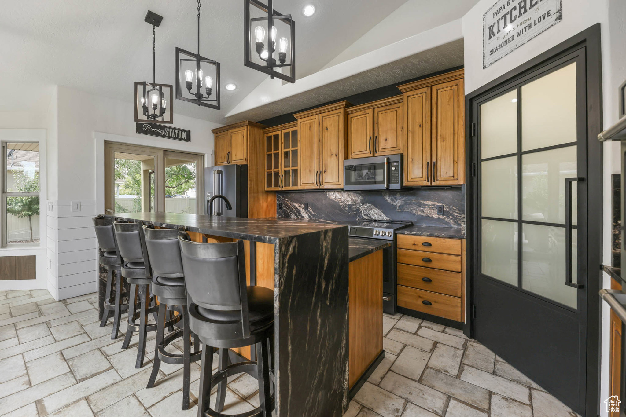 This custom 4-bed, 3.5-bath home (with a bonus room above the garage) has been carefully remodeled by a custom home builder, and it shows in every detail. Inside, you'll find new flooring, modern lighting, upgraded switches, and bathrooms with brand-new counters and fixtures-everything chosen for both style and comfort. The kitchen is the star of the show, complete with Cafe appliances, three ovens, waterfall granite, tons of cabinetry, and a double-sided fireplace that connects right into the bright family room. The primary suite feels like its own retreat: a fireplace, a mounted TV, a window seat, and even a hidden Murphy-style closet for a fun, functional surprise. Downstairs, the basement is already set up for flexibility-it's currently set up for a salon but is plumbed for a kitchen and has a large open family room, and a half bath that's ready for a future shower. Perfect for a guest suite, in-law apartment, rental ADU (just needs the kitchen), or even a home business with its own private entrance. There is even new flooring in the cold storage that can be used in the basement if desired. Step outside and you've got a 1,000+ sq/ft Trex deck, fully furnished, plus a Bullfrog hot tub Add in RV parking, a heated 4 car garage with a car lift, and pre-approval from the city for a detached garage or ADU, and the options here are wide open. This home is fully loaded with thoughtful upgrades, tons of functionality, and unique character you just won't find in brand-new builds. Check out the 3D Tour and schedule your showing today!