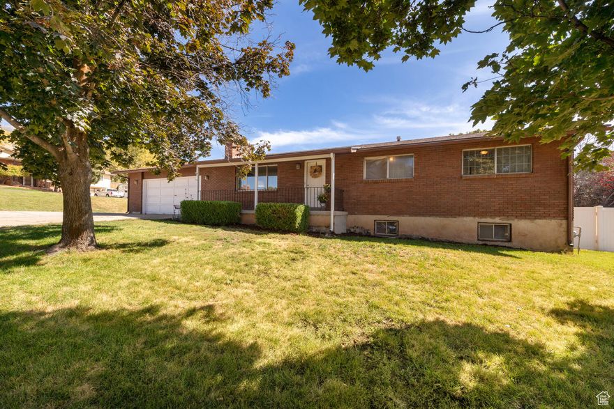 Lowest price in Fruit Heights!  This charming rambler feels like home the moment you arrive. The welcoming front room is perfect for gatherings, while fresh paint throughout gives the house a clean, modern glow. A thoughtful layout offers comfort and flow, with a generous lower level featuring a fabulous den / office area, large family room plus a generous laundry/craft area - perfect for hobbies, kids' projects, or flexible living space. Four bedrooms and three bathrooms provide room to grow, and the large backyard with a welcoming covered porch invites year-round relaxing and entertaining. All of this is tucked into a fabulous neighborhood you'll be proud to call home.  Square footage figures are provided as a courtesy estimate only and were obtained from tax records.  Buyer is advised to obtain an independent measurement. A one year home warranty with Old Republic Home Warranty is in place and will be paid for by seller price not to exceed $600