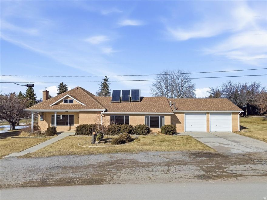 Welcome to the heart of historic Spring City- where small town charm meets peaceful country living. This inviting home offers room for entertaining and warmth with two cozy gas fireplaces. Step outside and enjoy your own slice of paradise, complete with a covered patio, several mature apple and peach trees, an automatic sprinkler system, outbuildings and plenty of space to make your dreams a reality. Whether you're envisioning room for your toys, a thriving garden, or a small hobby farm this property provides the flexibility and space to do it all. Located in a great neighborhood known for its historic charm and friendly community. Irrigation shares may be available. Square footage figures are provided as a courtesy estimate only and were obtained from county & owner. Buyer is advised to obtain an independent measurement. Buyer and buyers agent/broker to verify all information.