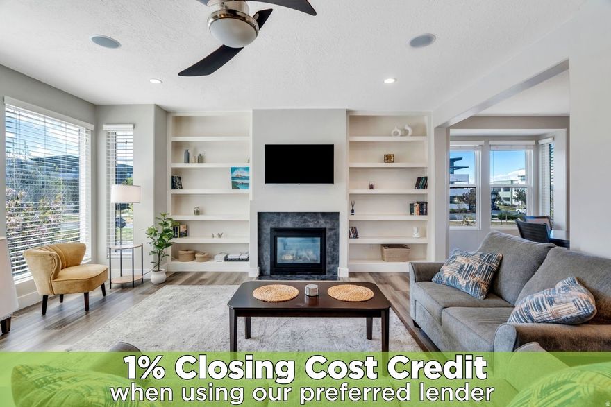 Welcome to this beautifully maintained Daybreak townhome, offering the perfect blend of comfort, functionality, and style.   The fenced front yard is a rare find, ideal for small dogs, playtime, or simply enjoying a bit of outdoor space of your own. Inside, you'll appreciate the thoughtful upgrades throughout, including custom built-ins in the living room, bedrooms, and closets, maximizing both storage and style.  The kitchen is warm and welcoming with rich cabinetry, granite countertops, stainless steel appliances, and a versatile coffee bar or built-in desk, perfect for your morning routine or a convenient workspace. Featuring a 2-car garage and a private balcony, this home provides both convenience and inviting spaces to relax.  With its smart layout, upgraded features, and desirable Daybreak location, this townhome offers easy, low-maintenance living in a vibrant community you'll love to call home.