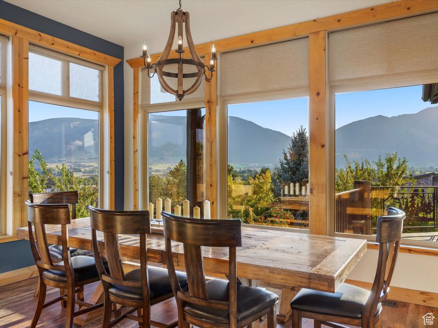 Your own mountain retreat. This charming mountain home in the Preserve at Sheep Creek, clad in rustic wood siding and surrounded by nature, offers 365 views of the Wasatch Range to enjoy on serene summer nights or snowy mornings.  The professionally designed landscape features mature aspens and pines with unique rock accents, fountains, and gas fire pits that make the secluded patio truly inviting. Inside, the main level is airy and bright. The vaulted ceiling in the main living space is anchored by a tall wood-burning fireplace, grand windows, and a wrap-around deck with sweeping views of the Wasatch Back. The vaulted ceilings, dark granite countertops, stainless steel appliances, and custom tile backsplash of the kitchen flows seamlessly into the dining area for effortless entertaining. The main-level primary suite includes a spacious walk-in closet, primary bath with double vanities, separate tub and shower, and direct access to the back patio for indoor-outdoor living. Upstairs offers two additional bedrooms with a full bath, and extra storage, while the lower level adds a second family room with a gas fireplace, additional bedroom and full bath. A two-car garage with abundant storage and oversized driveway complete with ample RV parking completes this beautiful mountain home.  A whole home attic ventilation system and backup generator are always on standby ready to keep you powered and comfortable year round. Square footage figures are provided as a courtesy estimate only and were obtained from county records; buyer is advised to obtain an independent measurement.