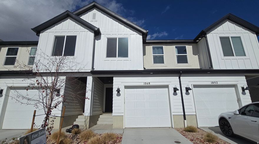Beautiful townhome in a great neighborhood. Located on the Lehi/Saratoga Springs border - close to shopping, schools, parks and trails. This home includes a main bedroom with walk-in closet, quartz countertops, stainless-steel appliances, one car garage and driveway and a smart home system. Enjoy hassle-free living, pool access, multiple parks, pickleball courts and a clubhouse for entertaining. Home Warranty, Active Radon Mitigation System, and Smart Home Package all included. please conduct your own survey regarding current/future school boundaries. Square footage estimates are provided as a courtesy only.