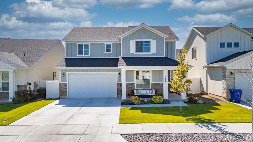 Move-in ready Powell plan-skip the construction dust and start living by Jensen Nature Park!  Wide-plank luxury vinyl plank floors lead to a cozy gas fireplace wrapped in shiplap and a bright, white shaker kitchen featuring quartz countertops, a five-burner gas cooktop, and double wall ovens. A versatile flex room off the entry offers custom floor-to-ceiling built-ins and a window seat, perfect for a home office or guest bedroom.  Upstairs, the spacious primary suite includes dual vanities, a soaking tub, an oversized shower, and a walk-in closet. Three additional bedrooms, a full bath, and a laundry room complete the upper level for maximum convenience.  Outside, enjoy entertaining on the extended paver patio while kids play safely on the in-ground trampoline within the fully fenced backyard. Additional features include a two-car garage, smart thermostat, and full sprinkler system.  Located just minutes from the new West Davis Highway for easy commuting and steps from Jensen Nature Park with miles of walking and biking trails. This home offers a perfect blend of comfort, convenience, and lifestyle-move right in and start living your best life!