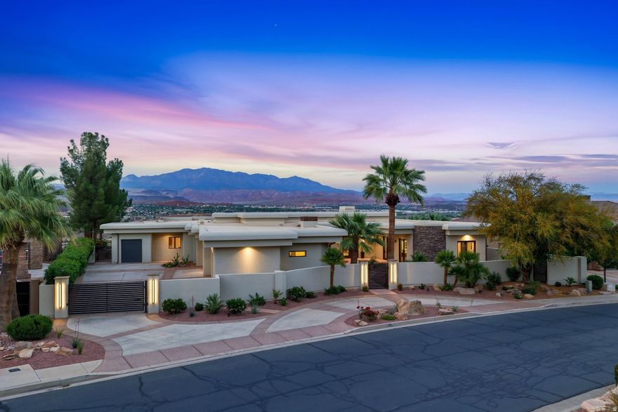 A rare opportunity to own a stunning, recently remodeled beautiful former Parade Home with unobstructed views of the Greater Saint George and Pine Valley Mountain. This absolute masterpiece of a home is perfectly designed and laid out to create a welcoming environment for you, your family, and your guests. This expansive, recently remodeled home captures the true essence of all of its original architectural design. The home's main features are 4,939 SqFt, 4 bedrooms (including the office), 3.5 bathrooms, 3.5 car garage (1,200+ SqFt), and 0.86 acres. Walk into the wide-open space of the living room, dining room, and kitchen to wind down for the day. With recent renovation work, it is truly remarkable to have been able to bring this beautiful home backs to its glory. The interior upgrades include upgraded kitchen appliances including refrigerator, dishwasher, pebble ice machine, refrigerated drawers, range hood, washer and dryer; hardwood flooring throughout, 120' Heliovision Virtual electric fireplace; complete bathroom remodels including countertops, lighting, hardware, vanity mirrors, and water softener. Exterior upgrades include a new roof, courtyard gas fireplace; air conditioning units and thermostats; outdoor kitchen with BBQ grill, new range, hood and fridge; infinity edge pool replaster with new tile, pumps, heater, and Pentair pool equipment; stucco wall painted with elastomeric paint, new landscaping, irrigation system, and 220v plug in the garage.  As one of the most desired and prestigious 24 hour guard-gated subdivisions in Saint George, Stone Cliff offers the perfect blend of privacy, community, and adventure. Centrally located and surrounded by some of our most sought-after restaurants, businesses, hospital, and wide range of amenities, there is no better feeling than being a few minutes away from your next stop. The main gathering clubhouse complex for the community boosts over 6,000 SqFt of social halls, catering kitchen, fitness center, indoor/outdoor pools/spa/splash pad, pool cabanas, outdoor seating, tennis court, pickleball courts, half basketball court, 24/7 gate with onsite security, walking/jogging trails, water fountains, and waterfall features throughout.  Situated in the city of St George in Southern Utah, the area is full of life and energy from its beautiful desert landscape, sheer mountain peaks, and area full of adventures. The home is a short drive to the majestic cliff walls of Zion National Park, the hoodoos of Bryce Canyon National Park, and the North Rim of The Grand Canyon. There is no place like it. Enjoy nearby hiking, biking, and outdoor adventures or any of the 4 amazing large reservoirs such as Sand Hollow, Quail Creek, and Gunlock, and thousands of recreational public acres for the adventurous at heart, such as the Dixie National Forrest and the breathtaking Snow Canyon State Park. The region is also known for its internationally renowned golf courses that recently hosted the PGA and LPGA tournaments and Pickleball Championships. Saint George is also the host for many events such as the Ironman, Red Bull Rampage, the Huntsman Senior Games Golf Championships, and the Saint George Marathon.