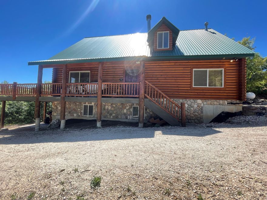 Back on the market just in time to plan all the summer fun at this beautiful log cabin in Fish Haven, Idaho! This very well maintained cabin comes fully furnished with 5 bedrooms, 3 bathrooms on the west side of Bear Lake. You can enjoy the outdoors any season at this beautiful property that overlooks Bear Lake with hiking trails, snowmobile trails, boating or swimming on the lake,  This cabin features an open floor concept with 3 different family rooms, a fireplace to gather in the cool evenings, a stylish full kitchen, and a full size bathroom on every floor!  NO overnight rentals!  HOA amenities include use of pool, tennis court, and private beach access.