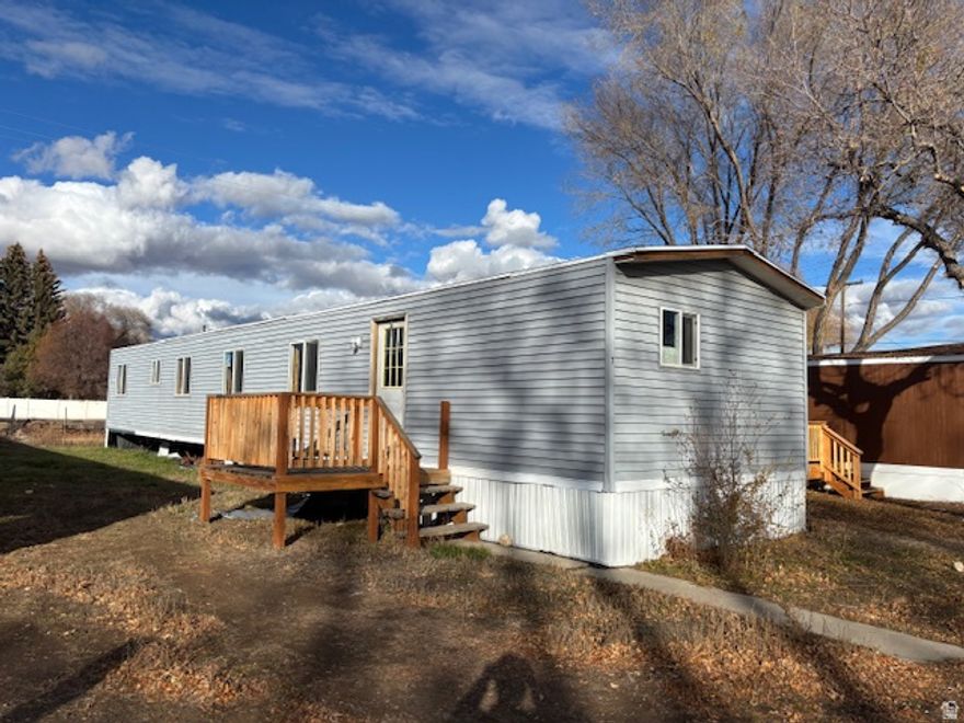 DIY enthusiast looking for your next project or inexpensive housing? This mobile home in Mile High Village Vernal, Utah, is priced to sell and offers a blank canvas for those with vision and skills. This property needs significant work and is an ideal opportunity for someone ready to roll up their sleeves and put in some sweat equity.