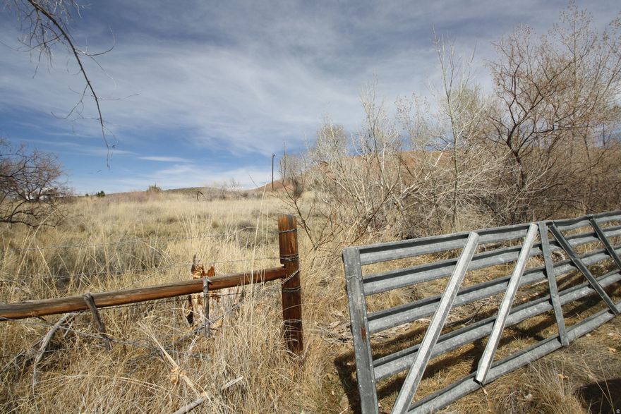 With 12.5 acres in Lapoint, Utah, you have a massive canvas to create a lifestyle that balances high-adrenaline adventure with quiet rural serenity. The Western canal provides a natural water feature and irrigation potential, while the surrounding hills offer immediate access to the Uintah Basin's rugged beauty. Serene Living & Building Opportunities Maximize the "where you want" freedom by situating your home to capitalize on both the canal views and the expansive Utah skyline. Waterfront Retreat: Design a Mountain Modern home or a classic rustic lodge near the Western boundary to incorporate the canal into your landscaping. A sprawling back deck with a stone fire pit or a covered patio can serve as a peaceful zone for sunset viewing. Outdoor living at it's best, Ride Horses in the Sunset, or your UTVs: Given the 12.5-acre size, you can build well away from the road for ultimate privacy. Use the canal for a lush garden or orchard, creating a self-sustaining rural oasis.