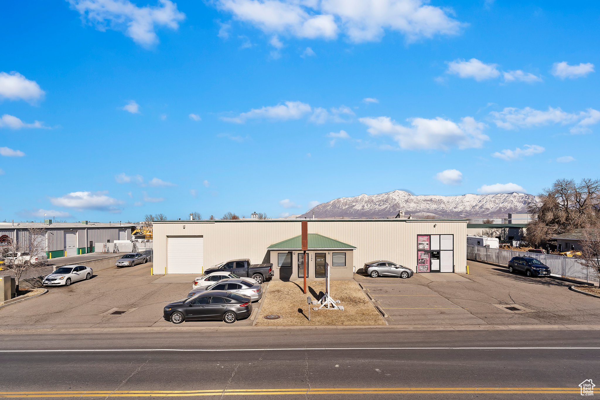 **Sublease Opportunity: Prime Industrial Space** Discover a fantastic sublease opportunity with this expansive  6,490 SF industrial building situated on a generous  0.75-acre lot, strategically zoned under Ogden City OCIP. This property features a spacious open warehouse, perfect for a variety of industrial uses, complemented by multiple 12' x 12' overhead doors that facilitate easy access for loading and unloading. Boasting high ceilings and an abundance of natural light, this space creates an inviting and productive work environment. The building also includes front and rear office spaces, ideal for administrative tasks or client meetings. With ample parking available for both clients and employees, convenience is at your fingertips. Additionally, the property offers a secure, fenced storage yard, providing peace of mind for your equipment and materials. Enjoy direct access to the freeway and major roads, making transportation and logistics a breeze. Don't miss out on this exceptional industrial space-schedule a visit today!