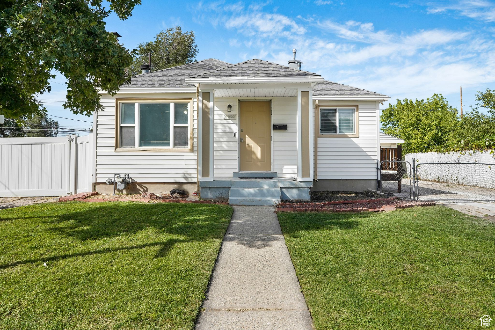 This fully remodeled home with a private ADU offers modern updates, flexibility, and plenty of space. Inside, you'll find a brand-new kitchen with quartz countertops, custom cabinetry, and new flooring throughout. The open layout is designed for comfortable everyday living as well as entertaining. The property also includes a full ADU with a separate entrance, complete with a kitchenette and its own washer and dryer hookups-ideal for extended family, guests, or rental income. An oversized detached garage provides room for up to four vehicles, with additional space for storage, projects, or a workshop. The exterior has been refreshed with updated paint accents and new columns, giving the home a clean, updated look. With a complete renovation inside and out, this home is move-in ready and offers the versatility today's buyers are looking for.