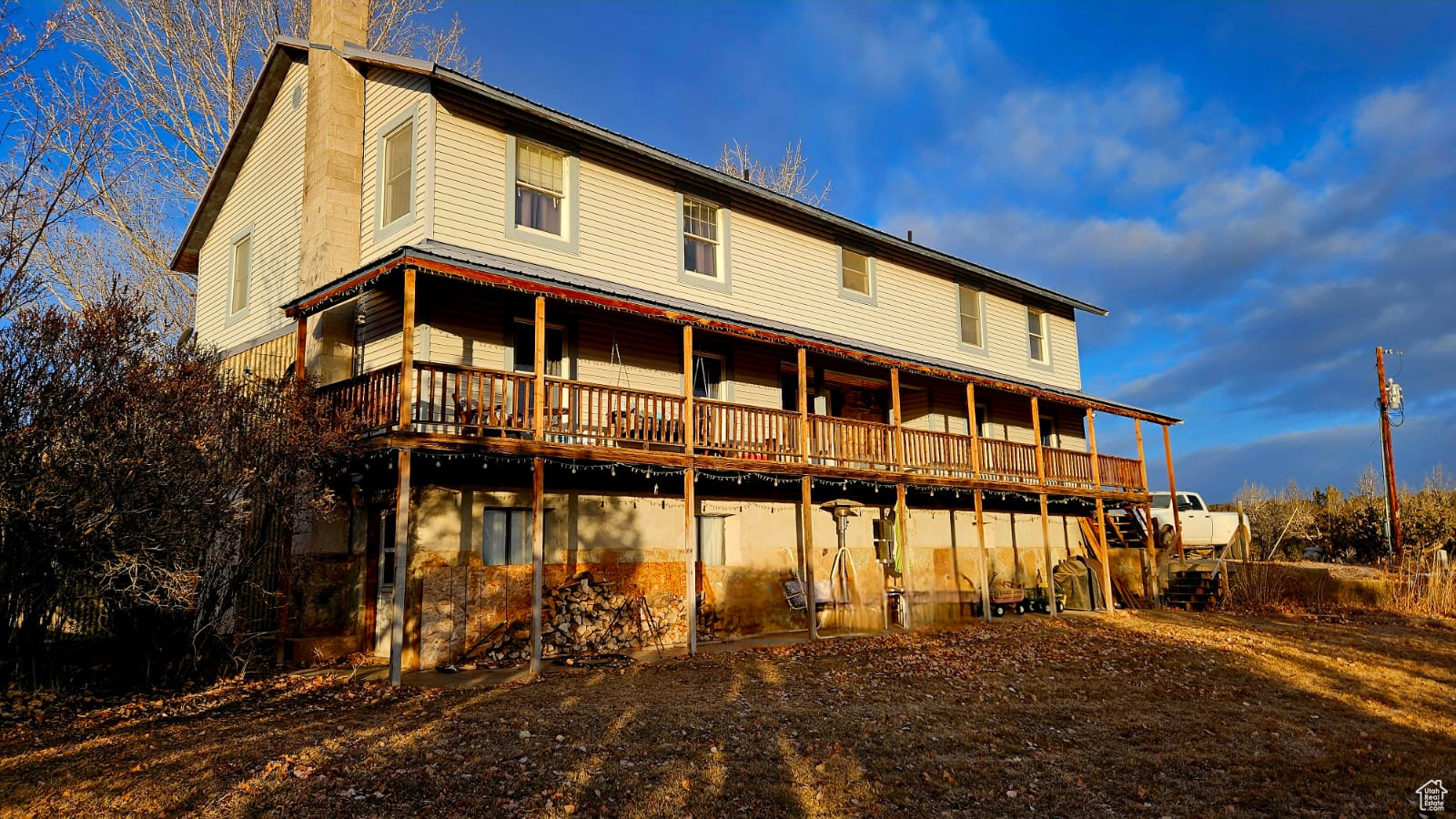 One of a kind secluded 5394 sqft, 7 bedroom home on 20 acres. Two full size kitchen's. Beautiful wall to ceiling cedar paneling throughout! Large OVERSIZED bedrooms throughout. 4 bedrooms on the second level alone! 2 wood burning stoves on the main level and one in the basement. Pantry and plenty storage throughout. Attached two car garage, attached 16'x21' greenhouse, overlooking 10 acres of pasture ground (included). Accessible ramp on the outside main level and indoor mobility stair lift to the second level bedrooms. Master bedroom on the second level with full bathroom; features a "Safe Step" walk-in tub with shower and Jacuzzi package which was installed in 2022 for $22,000. Metal carport stays with the home. Fiber internet is hooked-up. Culinary water well with owned water rights.