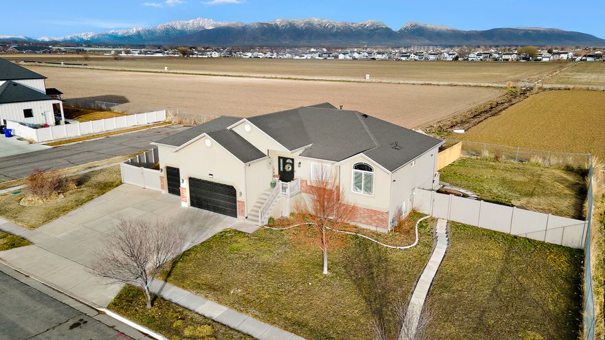 This spacious Syracuse retreat with beautiful mountain views! Located in a quiet, established neighborhood, this large, well-designed home offers room to live, work, and entertain comfortably.  Enjoy stunning views of the Wasatch Mountains, wide streets, and a peaceful community setting while still being just minutes from shopping, dining, parks, and everyday essentials. Situated in desirable Syracuse, this location is known for its friendly atmosphere, strong schools, and excellent quality of life.  Commuters will appreciate easy access to major roadways and nearby employment centers, including Hill Air Force Base. Spend weekends exploring nearby parks, walking trails, and Antelope Island, or relax at home and take in the scenic mountain backdrop.  With generous living space, scenic views, and a prime location, this home offers the perfect blend of comfort, convenience, and lifestyle.  Don't miss your opportunity to own this spacious home with mountain views in one of Syracuse's most sought-after communities!