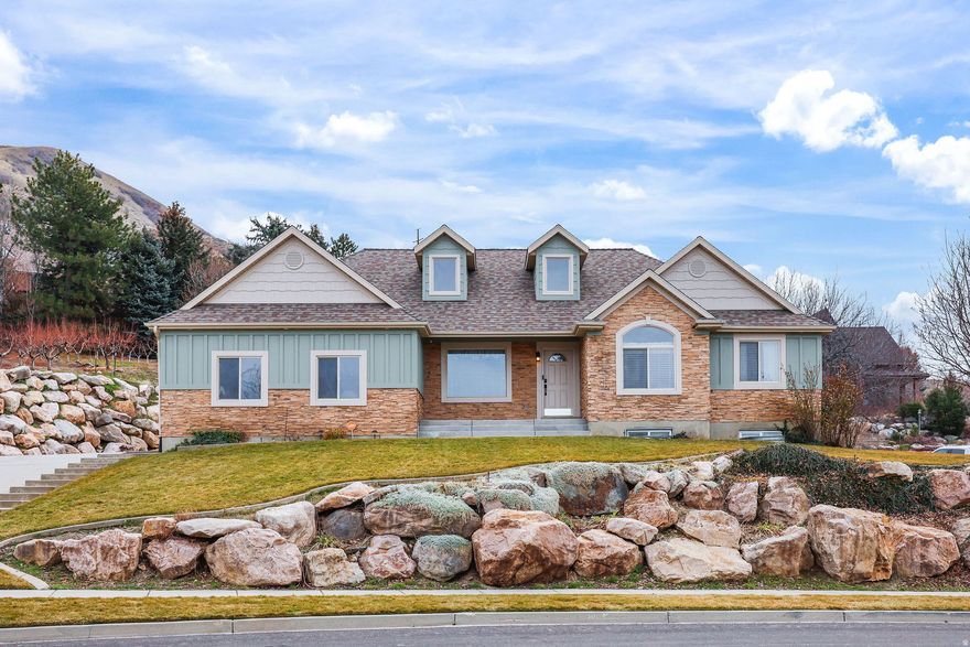 Wake up to mountain sunrises and unwind with panoramic valley sunsets!  Rare opportunity to own a beautifully situated home at the top of the road on Perry's east bench with breathtaking mountain and valley views. Located next to a peach orchard, this property offers the kind of setting that's hard to find and even harder to leave.  Inside, you'll find five bedrooms and three bathrooms with plenty of space to spread out. While the interior could use a little updating, it presents an incredible opportunity to personalize and add value in an already exceptional location.  If you've been waiting for a home with unbeatable views, end-of-the-road privacy, and standout landscaping - this is it.