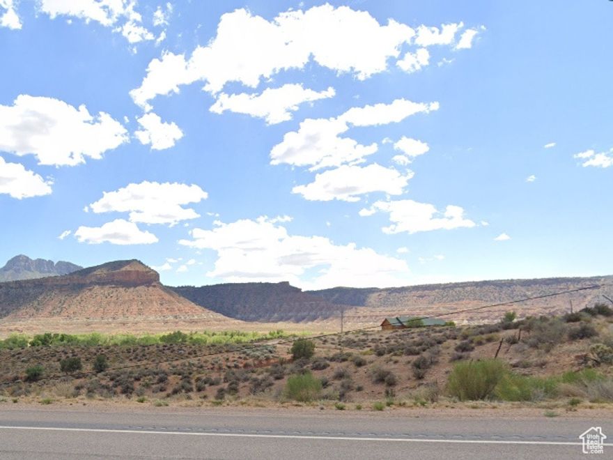 RARE multi-acre parcel 18.53 acres on the West end of Rockville Utah and the gateway to Springdale and Zion National Park Red Rock Wonderland. South Side of Main Street with Gentle slope to the Virgin River with mature trees along the river.  Stunning Views of red rocks and the green Virgin River valley. Gentle Slope to Virgin River.  Virgin River Runs along the South end of this property.  Absolutely stunning views of bluffs, desert-scapes, green Virgin River Valley and so much more. 1 (ONE) Culinary Water Share or Rockville Pipeline Residential Water Hook Up MAY BE included (people have been waiting for 20 years to get a culinary water share for Rockville). Rollback/Greenbelt Taxes to be paid by Buyer. Not zoned for commercial or nightly rentals.  If Culinary Water Share is transferred with this sale then Rockville Pipeline would allow access to the culinary water for $1000 stub fee and $100 transfer fee to a new owner.  All information deemed reliable but not guaranteed. Buyer responsible to verify all listing information, including square feet/acreage, to buyer's own satisfaction.