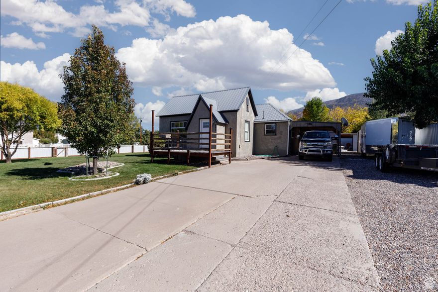 Welcome to your dream retreat! This incredible, meticulously maintained cottage-style home is bursting with charm and character, offering a cozy haven that feels like a warm embrace the moment you step inside. Nestled on a generous corner lot of just over a third of an acre, the property boasts a flawless, landscaped yard that is a true outdoor oasis. Imagine enjoying sunny afternoons in your thoughtfully designed garden spot or hosting gatherings in this delightful space. Three handy outbuildings provide ample storage and versatility for your hobbies or projects. Step inside to discover a host of modern updates that blend seamlessly with the home's inherent charm. Enjoy new flooring that flows throughout the residence, creating a fresh and inviting atmosphere. The sleek, new kitchen features stunning cabinets with soft-close drawers and stylish countertops, making meal prep a joy. The bathroom has been transformed with a seamless installation by Bath Fitter, adding both function and flair. Rest easy knowing this home has been upgraded with a new septic tank and drain system, along with a brand-new furnace and central air unit, ensuring comfort year-round. Cleanliness and attention to detail shine throughout, making this property one of the most immaculate homes you'll ever find. Located in an amazing neighborhood that offers convenience and tranquility, this cottage-style home is ready for you to make unforgettable memories. Whether you're enjoying a night in by the fire, entertaining friends, or tending to your garden, this charming abode is the perfect backdrop for your life. Don't miss the opportunity to call this enchanting home yours. Schedule your private showing today and experience all the warmth and wonder that awaits within these walls!