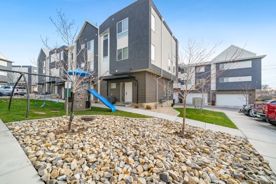 Welcome to this stunning newer end-unit townhome, built in 2022 and perfectly situated just minutes from Hill AFB and steps from TRAX for an easy commute to Salt Lake City. Offering 3 bedrooms and 3 full bathrooms, this home combines modern comfort with thoughtful design. The beautifully appointed kitchen features stainless steel appliances, a gas stove, and a refrigerator-all included. You'll love the laminate flooring throughout the main living areas, complemented by high-end finishes such as tile flooring and quartz countertops. As an end unit, this home is filled with natural light from the extra windows, showcasing scenic mountain views. The private upstairs suite is a true retreat, boasting a spacious walk-in closet and sleek private bathroom, and the front-load washer and dryer are conveniently located just steps from the bedrooms. Enjoy the community park right outside your front door-visible from the windows and perfect for a quick stroll or playtime. Homes like this, in such excellent condition and at this price, are rare, so don't miss your opportunity to make it yours!  Pre-approved buyers only. Square footage figures are provided as a courtesy estimate only and were obtained from county records.  Buyer is advised to obtain an independent measurement.