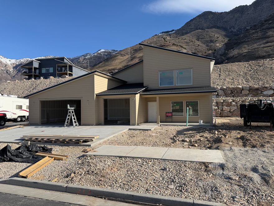 AWSOME VIEWS!!!! Main floor living with the Master and a Laundry on the main. At this stage of construction you could pick interior colors. Features 4 Bedrooms 3 and 1/2 baths and a huge garage.