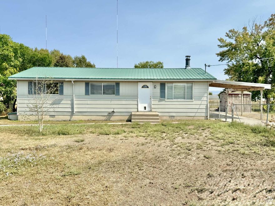 3 bedroom home on large lot!  Single level living, metal roof, and lots of room for RV's. Large back yard, insulated outbuilding and workshop with electrical and wood burning stove.  Room for future shop or garage.  Home is being sold in AS-IS condition.  SF and information provided as a courtesy, buyer to verify all. Thanks!