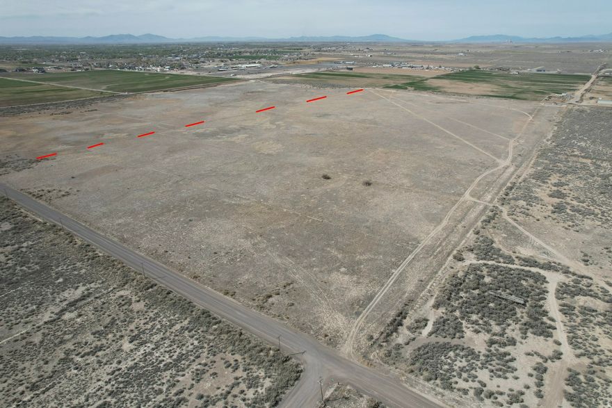 79.43 acres of vacant land located just outside the Delta city limits with AG-1 zoning, offering excellent potential for residential, recreational, or future investment use. This property provides wide-open space and convenient access while still being close to town amenities. The Delta area is seeing significant industrial growth, including new data center developments planned near Delta. More land available from same seller. Address is approximate. Buyer to verify all information.