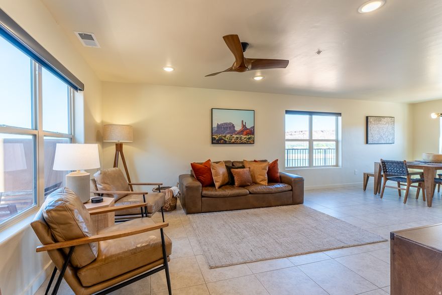 Experience the perfect blend of modern comfort and Southwestern charm in this beautifully designed two-bedroom townhouse, approved for nightly rentals and ideal for generating consistent income. Thoughtfully curated with warm desert tones, and contemporary decor, this property offers a stylish retreat for both owners and guests.  The open-concept living space is filled with natural light and showcases breathtaking red rock views that create an unforgettable desert backdrop. The kitchen featuring stainless steel appliances flows seamlessly into the dining and living areas, making it perfect for relaxing after a day of adventure or entertaining guests.  Step outside to enjoy the surrounding scenery, where stunning red rock vistas and peaceful desert ambiance set the tone for a peaceful night at your desert getaway.   Whether used as a personal getaway or an income generating nightly rental, this turnkey townhouse offers an exceptional opportunity to own a desert retreat that blends lifestyle appeal with income potential.