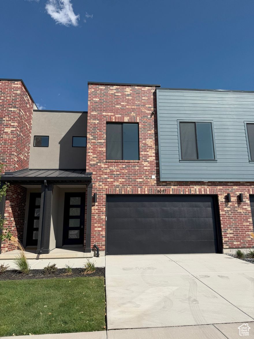 Builder will contribute $10,000 towards closing costs if this closes by December 31st, must use builder's lender. Welcome to this exceptional new construction townhome nestled in Sandy, Utah. Boasting premium finishes, ample natural light, and an open-concept layout, this townhome is designed to blend contemporary style with functional living. Equipped with GE Profile appliances, including a gas range and range hood, this kitchen is a chef's dream. Elegant cabinetry, sleek countertops, and a spacious layout make cooking and entertaining a delight. The spacious master suite features a large walk-in closet and a luxurious four-piece bathroom and a covered balcony with breathtaking views of the surrounding mountains; the perfect spot to enjoy a morning coffee or unwind in the evening. Two large secondary bedrooms, each with a walk-in closet, offer ample space for family, guests, or a home office. The unfinished basement provides endless possibilities-add a family room, extra bedroom, and bathroom to suit your lifestyle needs and maximize your living space. This modern townhome is ideally located in a quiet neighborhood, and is just minutes from shopping, dining, and outdoor recreation, with quick access to major highways and the stunning Wasatch Mountains. Whether you're entertaining guests, relaxing in your master retreat, or envisioning future upgrades in the basement, this townhome offers the ideal canvas for your next chapter. Don't miss the opportunity to own this stunning new construction townhome-schedule your private tour today!