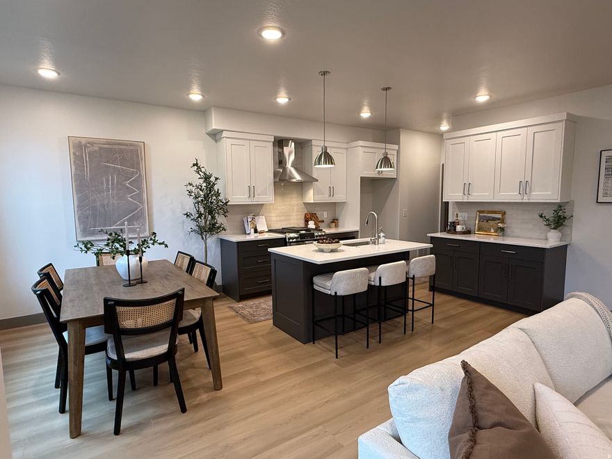 Builder will contribute $10,000 towards closing costs if this closes by December 31st, must use builder's lender. Welcome to this exceptional new construction townhome nestled in Sandy, Utah. Boasting premium finishes, ample natural light, and an open-concept layout, this townhome is designed to blend contemporary style with functional living. Equipped with GE Profile appliances, including a gas range and range hood, this kitchen is a chef's dream. Elegant cabinetry, sleek countertops, and a spacious layout make cooking and entertaining a delight. The spacious master suite features a large walk-in closet and a luxurious four-piece bathroom and a covered balcony with breathtaking views of the surrounding mountains; the perfect spot to enjoy a morning coffee or unwind in the evening. Two large secondary bedrooms, each with a walk-in closet, offer ample space for family, guests, or a home office. The unfinished basement provides endless possibilities-add a family room, extra bedroom, and bathroom to suit your lifestyle needs and maximize your living space. This modern townhome is ideally located in a quiet neighborhood, and is just minutes from shopping, dining, and outdoor recreation, with quick access to major highways and the stunning Wasatch Mountains. Whether you're entertaining guests, relaxing in your master retreat, or envisioning future upgrades in the basement, this townhome offers the ideal canvas for your next chapter. Don't miss the opportunity to own this stunning new construction townhome-schedule your private tour today!