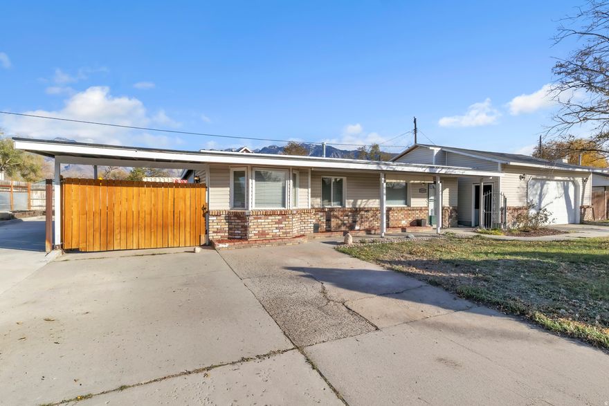 Beautifully remodeled Sandy home! Freshly updated throughout with a modern kitchen featuring new finishes, stainless appliances, and open, light-filled living spaces. Oversized garage doubles as a workshop, perfect for projects or extra storage. Xeriscaped backyard with gazebo and outdoor lighting creates a relaxing retreat.Move-in ready, close to schools, parks, and mountain trails - a perfect blend of comfort, function, and location!