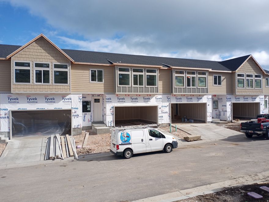 Under Construction- Short term rental approved townhome ready in April/May 2026! Pictures are of a finished unit and will have similar finishes. This unit includes a fully finished basement with over 600 additional sq ft to use as a bunk room or 3rd family room. Great views of the lake from the top floor. RV parking lot on site. Bike trail from subdivision