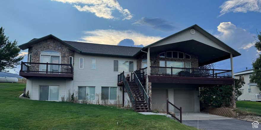 NEW TO THE MARKET (NO HOA) Looking for an investment property in the Heart of Bear Lake? This is a great one. You Can Make up to $40000 to $50000 is what this home could GROSS per year in the short term rental pool. You wont want to miss this Beautiful Bear Lake home located in Buttercup Estates. Great views of Bear Lake and the mountains. Paved roads, Close to the Garden City park/fish pond, bike path and City park beach access. Sold turn key furnished and ready for summer bookings. Personal items and some pictures are exempt. NIGHTLY RENTALS ALLOWED!!Garage could easily be converted into a great game room commanding more money per night, up to $600 per night. Call us today to schedule a showing! Its ready for your next business adventure and great family memories when your not making money.