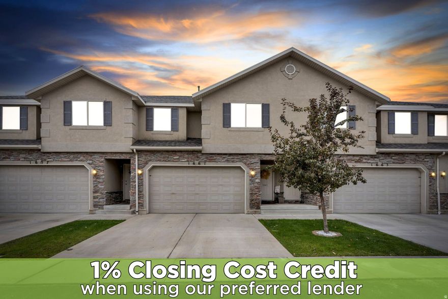 Step into a bright and welcoming open-concept main level where comfort and style come together effortlessly. Wood-look flooring and a light, airy palette set the tone, while the spacious living room invites you to relax with a sleek ceiling fan, neutral finishes, and a wall-mounted TV setup for modern living. The dining area flows seamlessly from the living space, highlighted by a chic light fixture-perfect for everyday meals or entertaining guests.  The kitchen is a true standout, featuring crisp white cabinetry with stylish hardware and glass-front accents, complemented by a classic subway tile backsplash. Warm butcher block countertops add character and charm, while stainless steel appliances-including a smooth-top range and built-in microwave-offer both beauty and functionality. Recessed lighting enhances the bright, open feel of this beautifully designed space.  Upstairs, unwind in the expansive primary suite, a peaceful retreat complete with a spa-inspired ensuite bath featuring a separate soaking tub and shower, plus a spacious vanity. A large walk-in closet provides ample storage. Two additional bedrooms, a full bathroom, and the convenience of upstairs laundry complete the upper level.  The lower level opens to a generous family room-ideal for movie nights, game days, or hosting friends. Outside, enjoy a private fenced backyard, perfect for relaxing, grilling, or letting small pets play.  Beyond the home, the community offers an exceptional lifestyle with a large shared green space for neighborhood gatherings, proximity to the local elementary school within a mile, and easy access to the Jordan Canal walking trail. With shopping, dining, and everyday conveniences just minutes away, this home truly has it all. Ask us how you can receive a 1% credit toward your closing costs when purchasing with our preferred lender! .