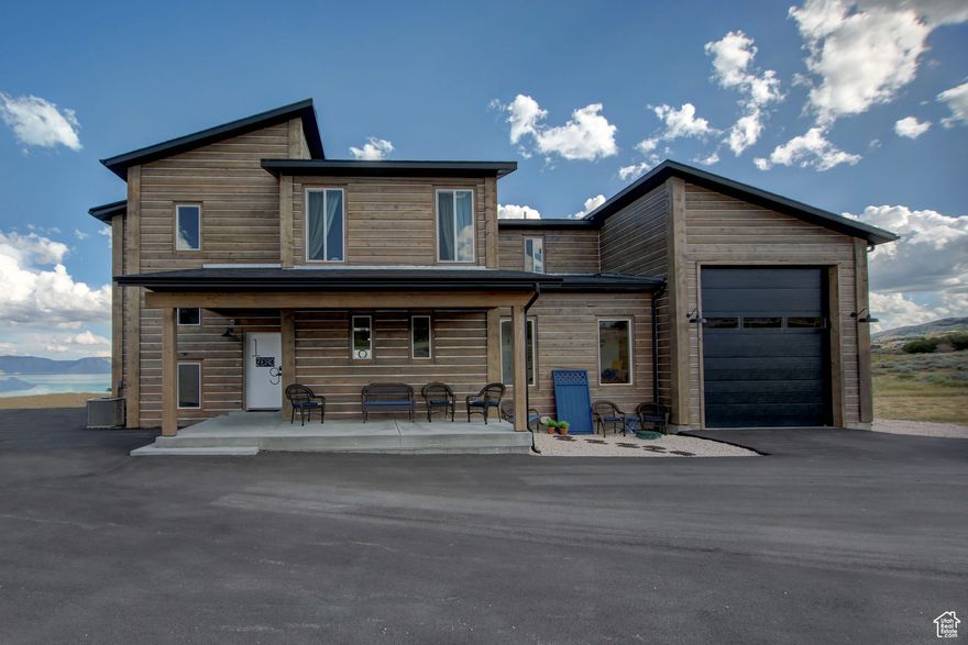 Stunning Mountain Modern Retreat in Aspen Creek Meadows with Panoramic Bear Lake Views!!! Discover the ultimate mountain escape in this beautiful new custom-built home in Aspen Creek Meadows. Crafted with striking 10-inch logs and designed with timeless mountain modern style, this three-level masterpiece offers 7 spacious bedrooms, 6 bathrooms, and breathtaking views of Bear Lake from nearly every room. Enjoy seamless indoor-outdoor living with a covered front porch, two covered decks, and a covered lower patio-perfect for taking in the scenery year-round. The home sits on a paved lot with a RV-size garage, paved driveway, and parking for 10+ vehicles-a rare find in this scenic location. Inside, the open-concept living spaces blend rustic charm with modern comfort. Nearly all furnishings and decor are included, making this property truly turn-key. With short-term rentals allowed, it's also an excellent investment opportunity. Outdoor enthusiasts will love the direct access to the Fish Haven Canyon trailhead for ATV riding, snowmobiling, snowshoeing, hiking, and mountain biking. As a homeowner, you'll also enjoy private beach access on the shores of Bear Lake-exclusive to owners in the subdivision. To top it off, the property features a spectacular gazebo and fire pit area using historic Bear Lake Marina dock material with postcard-perfect views of the lake, creating the perfect gathering spot for family and friends. Whether you're looking for a luxurious family retreat, an income-generating rental, or both-this one-of-a-kind home offers it all. Schedule your private showing today and start living the Bear Lake lifestyle!