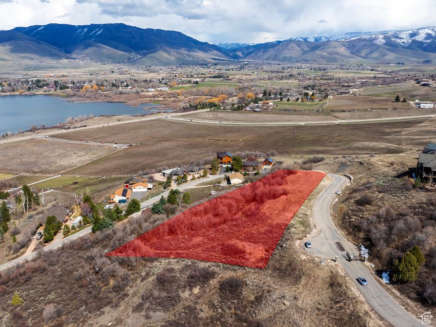 Build your dream home on this exceptional 2.13-acre lot in the heart of Ogden Valley. Located in scenic Huntsville, this property offers sweeping views of both Pineview Reservoir and the surrounding Wasatch Mountains, creating a truly breathtaking setting. Whether you're envisioning a modern mountain getaway or a full-time residence, the views alone make this an opportunity that's hard to match. Just minutes from Snowbasin Resort and a short drive to Powder Mountain, the location is ideal for year-round adventure. Enjoy skiing, snowboarding, hiking, biking, and lake activities-all right outside your door. Pineview Reservoir is close by for boating and paddleboarding in the summer, while the peaceful setting offers four-season beauty and recreation. With no HOA, you'll enjoy the freedom to design and build without restrictive oversight. A geo-technical study has already been completed, and the water connection fees have been paid, giving you a strong head start on the building process. Access is easy and convenient year-round, and the lot offers both privacy and proximity to all the best that Ogden Valley has to offer. This is a rare chance to own a prime piece of land in one of Northern Utah's most desirable locations-don't miss it. Buyer to verify all.