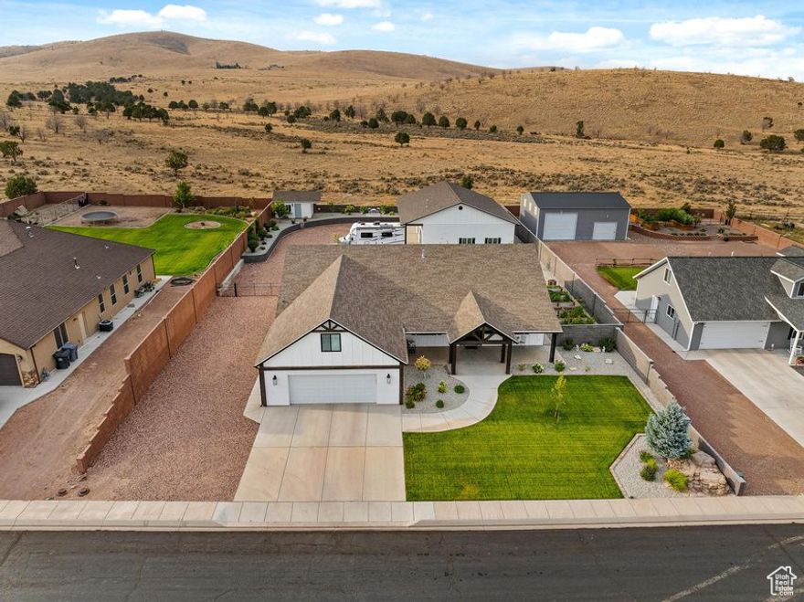Custom Country Dream Home w/ Stunning Mountain Views. Built in 2017, 3,311sqft w/ 4 beds (2 masters), 4 baths, large 0.51 acre lot w/ an oversized attached 2-car garage (710 sqft) w/ epoxy/sealed flooring & new garage cabinets. Updated with new windows, new entry door, new LVP flooring. Large chef's kitchen w/ all the upgrades of granite countertops, custom cabinetry, built-in stove top. Get cozy by the fireplace. Fully fenced yard w/ new landscaping, sprinklers, water feature, garden boxes w/ sprinkler system & gazebo w/ an outdoor kitchen area. The heated and insulated 50x35 (1,400 sqft) 6 car double door shop is a craftsman's delight, w/ 50 amp RV hookup w/ clean out. Shop has an attached office/bedroom (w/ mini split) and full bathroom with ample storage above shop office.A must buy!