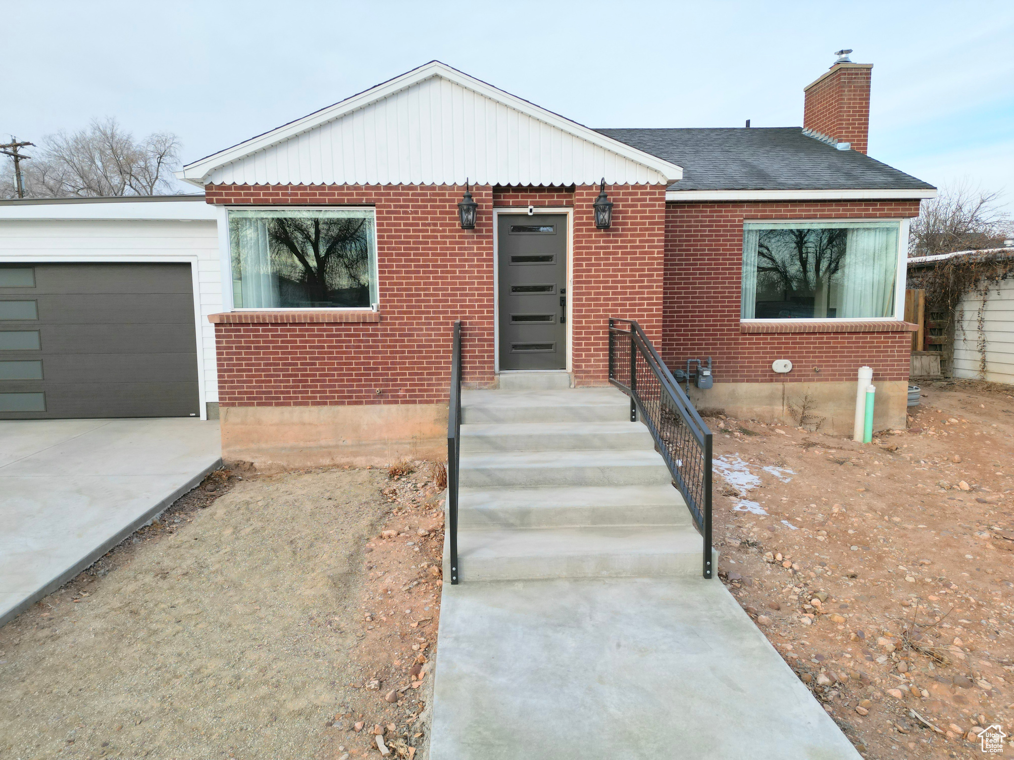 TOTAL REMODEL IS AN UNDERSTATEMENT! One of a kind 1958 home completely remodeled in 2023. Stripped to the studs and supporting walls this 2064 SF of custom redesigned floorpan is incredible. The wide welcoming steps along with custom metal railing of this adorable red brick home now featuring 3 bedrooms and 2.5 baths, two living spaces with an oversized 1 car garage (garage is plumbed for a gas heater) on .18 acres is dreamy. Enjoy the gorgeous custom cabinets throughout, granite & quartz countertops, top quality appliances and fixtures, stunning high end lighting, on demand hot water heater and dispenser (in kitchen), water softener, wood flooring, shiplap vaulted ceilings in the main room and master bedroom and a wood burning stove insert with custom mantle. The master bath is completely custom with built-in cabinet closets and drawers, a huge natural stone shower with 4 body sprays, accent tile backsplash and natural stone flooring in each bathroom feels like a spa everyday. All new electrical, gas, water & sewer lines-all the way to the city on each of them. Then step outside the master suite to a spacious deck and brick pavers leading to the garage, the partially fenced yard and secondary water will be a bonus as you design the yard to your liking. Square footage figures are provided as a courtesy estimate only and were obtained from county records. Buyer is advised to obtain an independent measurement.