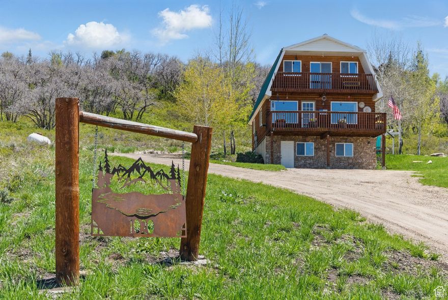 Modern Mountain Cabin with Stunning Witts Lake Views-Your Year-Round Escape Awaits!  Welcome to your mountain getaway, perched perfectly above Witts Lake with jaw-dropping views all the way to Park City! This beautifully maintained and updated cabin is move-in ready and made for either full-time living or weekend adventures. It is located on the paved road for easy access in all seasons, but set high enough off the road for privacy and to maximize views.   Inside, you'll love the fresh, modern feel thanks to a full 2019 update. Warm up by the pellet stove on chilly evenings or gather outside on one of the two decks or the patio for summer BBQs and stargazing. The gently sloped lot has lots of room to add additional square footage, a garage, or carve terraces to the landscaping to maximize the higher elevation views. Aspens and scrub oak frame the home and welcome large wildlife on their way to Witts Lake.   Extras? You bet-there's a road-base driveway, a rustic barn wood shed, an in-ground trampoline for the kids (or the young at heart), and plenty of room to play or store the toys. Whether you're snowmobiling straight from the front door or hiking Timber Lakes' trails in the summer sun, adventure is always just a step away. The water system in Timberlakes was redone a few years ago, it tastes amazing and has won awards!  Timberlakes is less than 15 minutes Heber City's Main Street, about 20 minutes to the new Deer Valley East resort, and an hour to the new SLC airport. Yet this home feels like it's in a whole different world. Enjoy the community lakes and ponds (great for kayaking), a tubing hill, and even Lake Creek river access. With thousands of acres of National Forest accessible from the community, this is more than just a home-it's a lifestyle.  Come see for yourself why this cabin checks all the boxes for mountain living with modern flair. Your dream retreat is calling! Easy to show , but an appointment is required as the property is occupied. Buyer to verify all listing information to their satisfaction.
