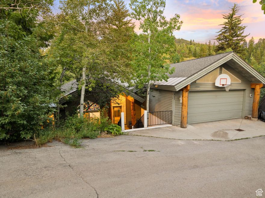 Welcome to this light-filled 6-bedroom, 3-bathroom retreat nestled in the desirable Timberline neighborhood of Park City, where nature, comfort, and adventure seamlessly come together. Backing to a seasonal stream and open space, this spacious 4,600+ square foot home is designed for both everyday living and year-round fun. Inside, you'll find two large living areas, including a walkout basement family room complete with a cozy fireplace and a full wet bar-the perfect space for entertaining or relaxing after a day on the slopes or trails. Sunlight pours in through large windows, and multiple sun-soaked decks provide the ideal spot to take in the fresh mountain air and serene surroundings. The backyard is a dream playground for young adventurers, featuring treehouses, a slide down to the creek, a trampoline area that converts into an ice-skating rink in winter, and plenty of room to explore. This is more than just a home-it's a lifestyle, offering a rare combination of space, location, and outdoor enjoyment in one of Park City's most scenic and active communities. Whether you're looking for a full-time residence or a mountain escape, this Timberline gem offers the perfect setting to create unforgettable memories.