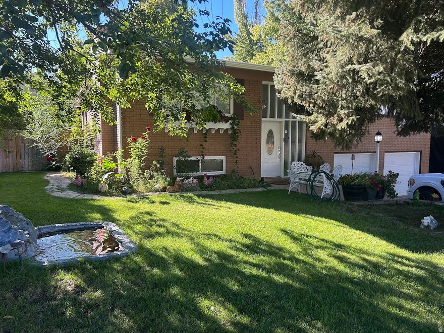 You will fall in love when you step inside this spacious, clean and updated home located in the coveted South Ogden location.  Complete with 4 bedrooms,  2 full baths,  upper and lower level family rooms,  two fireplaces and generous sized dining area.  Kitchen has ample amount of storage space which opens up to beautiful living area with cozy fireplace and dining.  Enjoy making your own pizza in the built in pizza oven on the large covered patio.  The yard is spectacular with waterfall/pond that brings peace and tranquility to the private backyard.  Close to shopping, schools, Weber State College, canyons and highway 89 makes this the perfect location. Newer water heater, roof and windows.  Square footage figures are provided as a courtesy estimate only and were obtained from owner .  Buyer is advised to obtain an independent measurement.