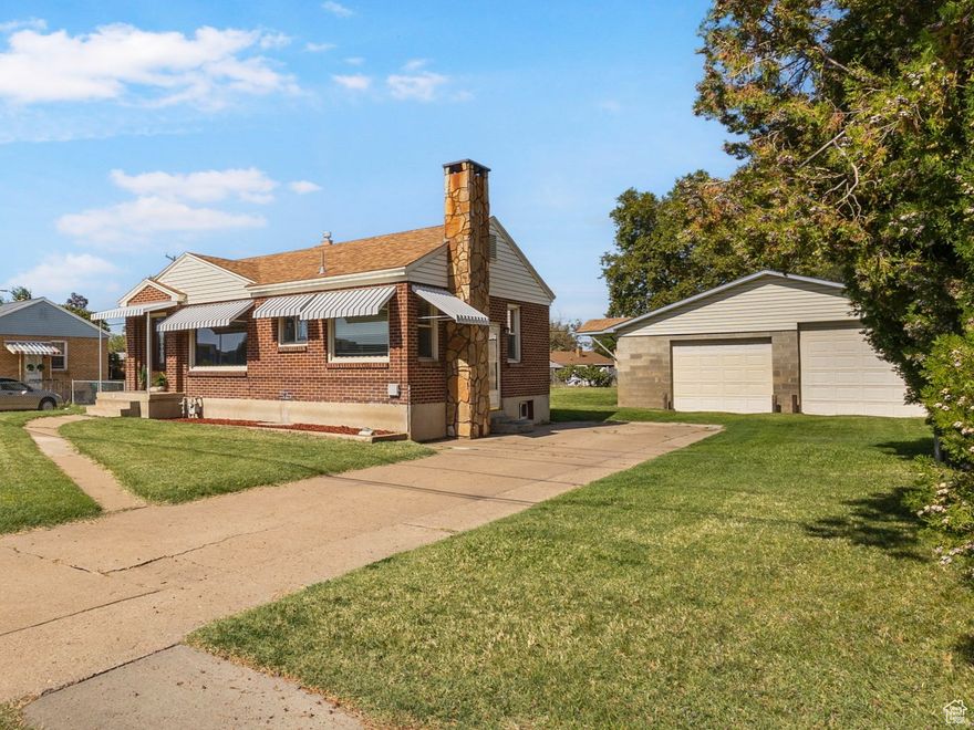 Welcome to this charming all brick rambler. Inside you will find a modern kit. w/ceramic tile flooring, solid wood cabinets, gas stove and frig. included. Updated flooring & paint through-out, 2nd family room down and several built-in. Don't miss the detached, double deep 28'x40' 4-car garage with an 8' & 9' door, plenty of room for everything. This home has lower utility bills with updated 95% furnace/AC (Trane) in 2022, hot water heater, updated modern windows (vinyl double pane) and new roof in 2019. Like new carpet throughout, all high-density nylon, fresh paint, and full sprinkler system. Convenient to a large park, elem. school and shopping down the road. Stop by and see this one today!!