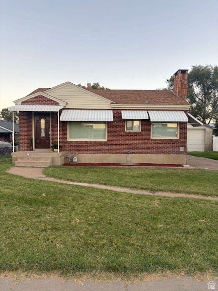 Welcome to this charming all brick rambler. Inside you will find a modern kit. w/ceramic tile flooring, solid wood cabinets, gas stove and frig. included. Updated flooring & paint through-out, 2nd family room down and several built-in. Don't miss the detached, double deep 28'x40' 4-car garage with an 8' & 9' door, plenty of room for everything. This home has lower utility bills with updated 95% furnace/AC (Trane) in 2022, hot water heater, updated modern windows (vinyl double pane) and new roof in 2019. Like new carpet throughout, all high-density nylon, fresh paint, and full sprinkler system. Convenient to a large park, elem. school and shopping down the road. Stop by and see this one today!!